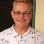 Doctor Colin Priestland smiling at the camera for his profile pictures to be taken.
